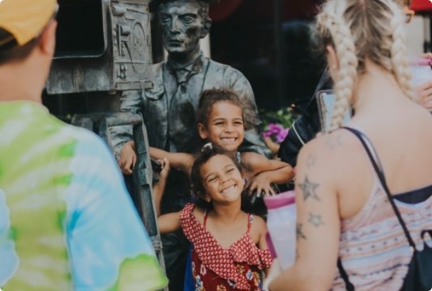 People smiling for the camera at a festival in Muskegon, Michigan